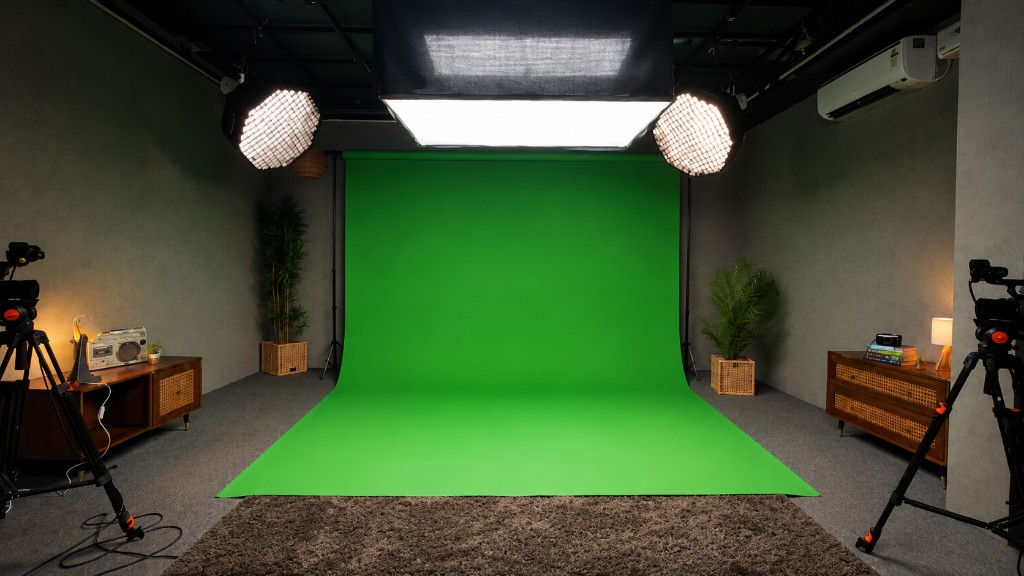 Green infinity podcast studio with seamless chroma key backdrop, dual cameras on tripods, and professional lighting at Winterfox Studios