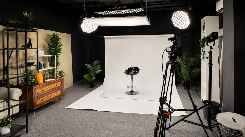 White infinity podcast studio with seamless backdrop, bar stool, overhead softboxes, and professional camera at Winterfox Studios